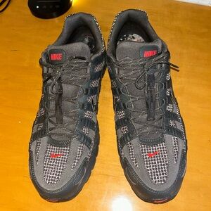 Nike Black and Gray Athletic Shoes with Red Highlights